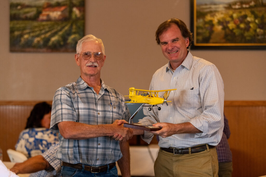 US Agriculture Undersecretary Robert Bonnie with rice seeding pilot Rick Richter